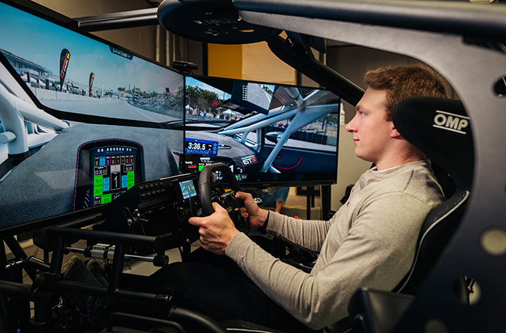 Motorsports engineering student works in a simulator