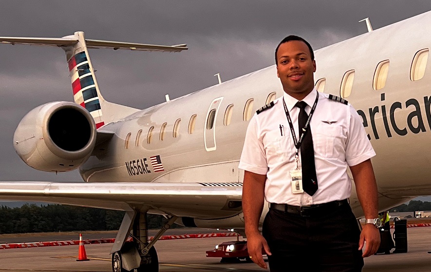 Markel Jones in front of a plane